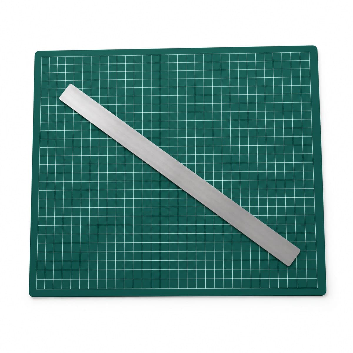 A dark green cutting mat with a fine white grid and a steel ruler lying across it